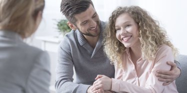 Happy couple in therapy with Marriage therapist