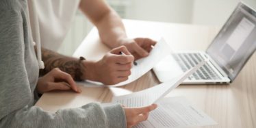 Two psychology students studying online