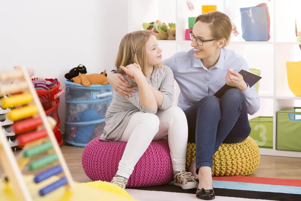 Behavioral Psychologist Talking To Her Young Patient After Getting Her Degree Online