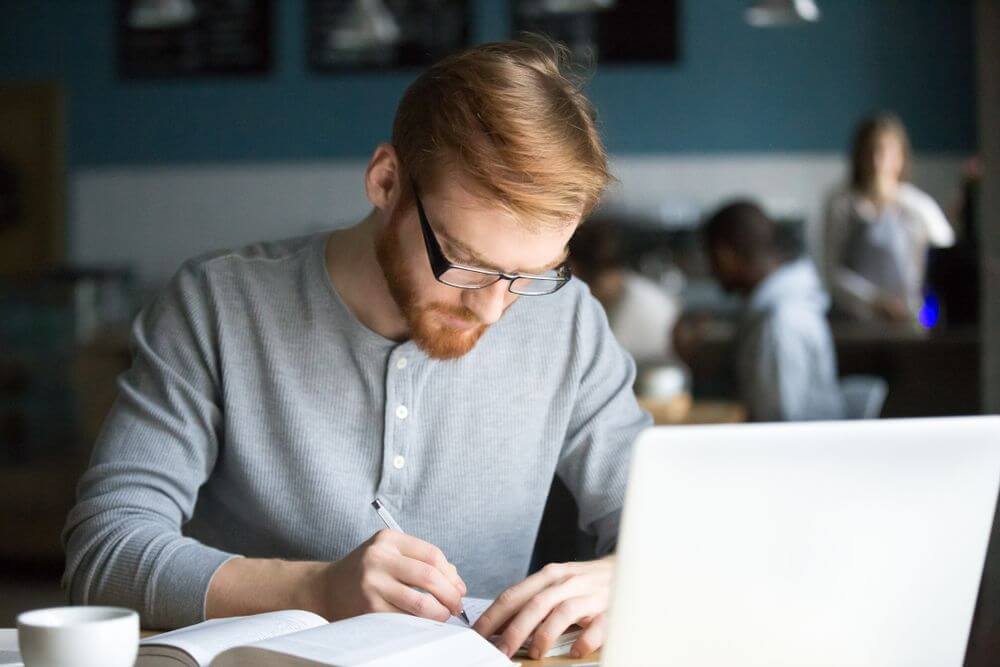 District of Columbia Student Studying Online For Psychology Doctorate Degree at Coffee Shop