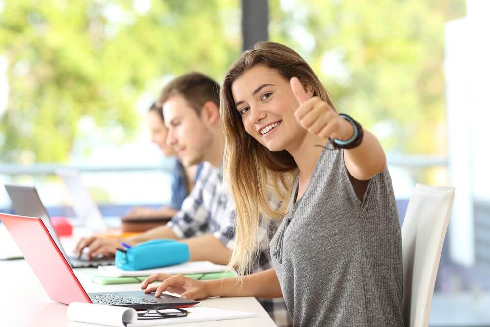 Alamaba Student Giving Thumbs Up While Studying For Her Psychology Masters