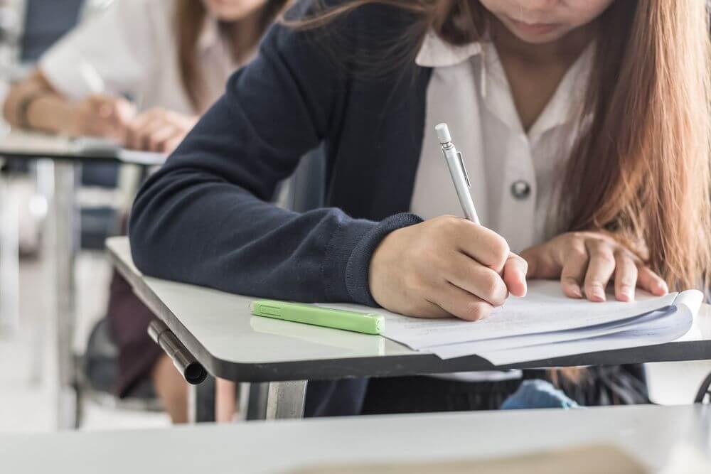 Hawaii Student Taking Test in Class For Online Psychology Doctorate Degree